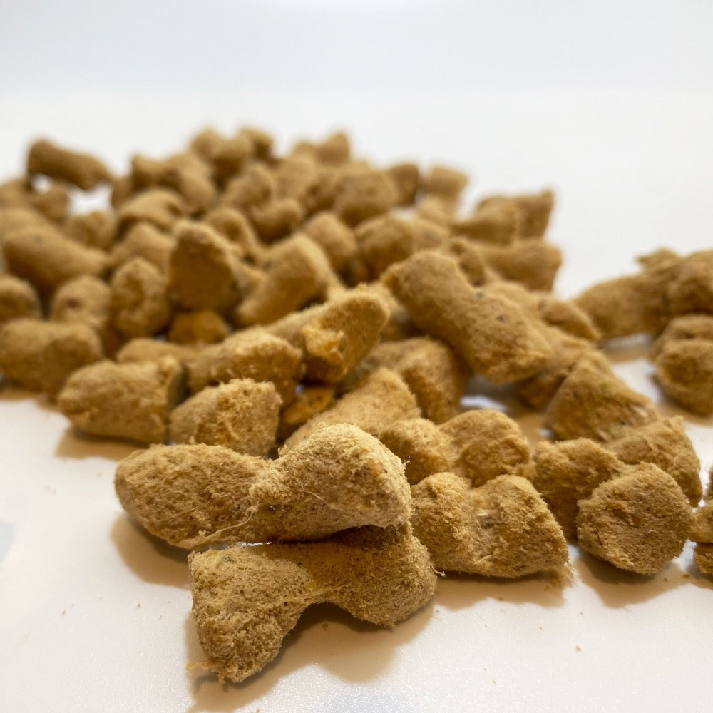 Freeze-dried treat nuggets on a white surface