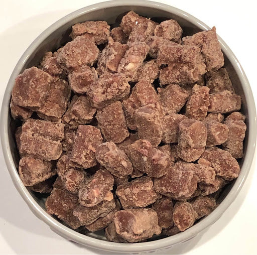 Bowl of freeze-dried raw nugget food for dogs